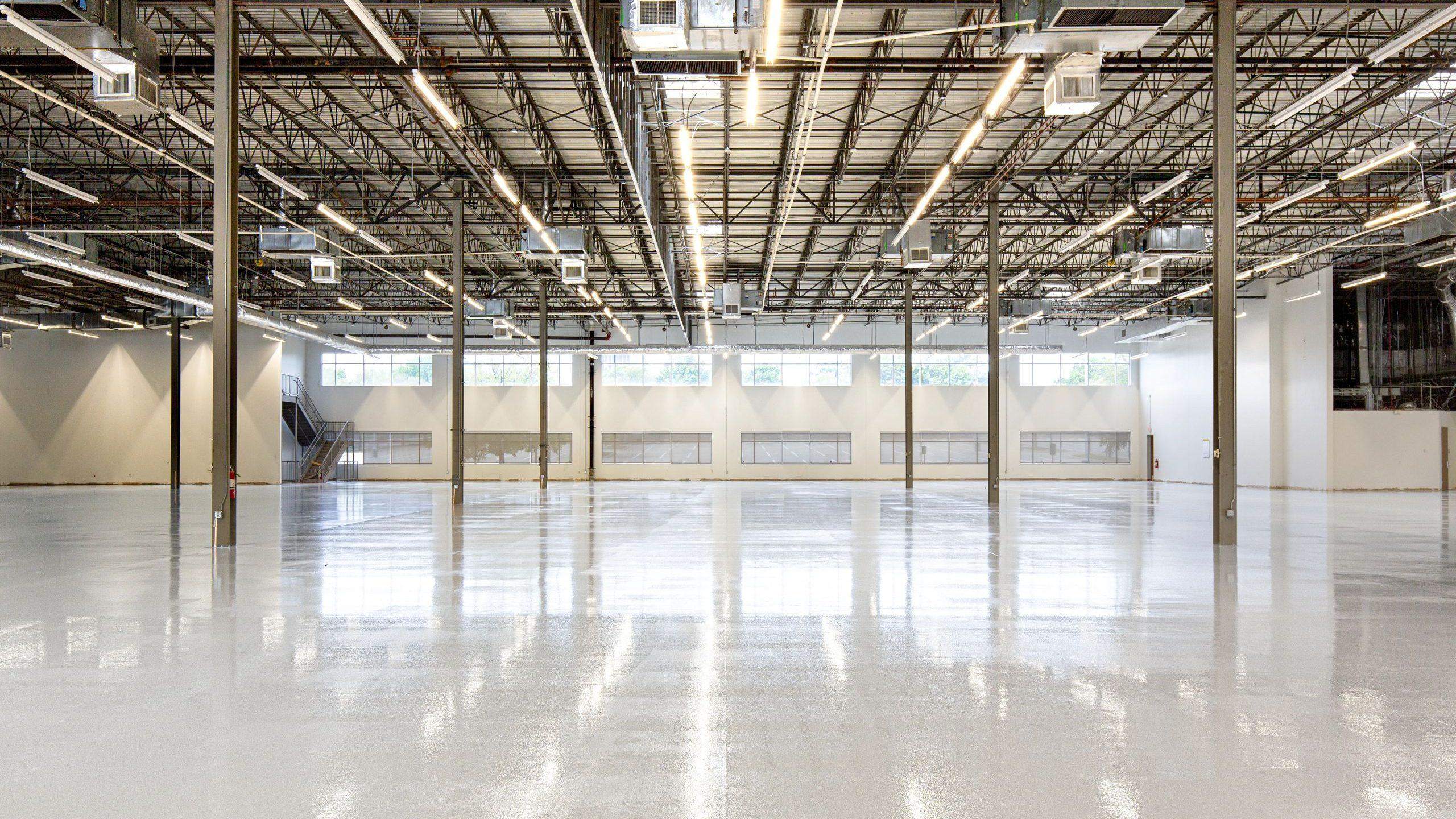 An empty industrial floor lit by daylight